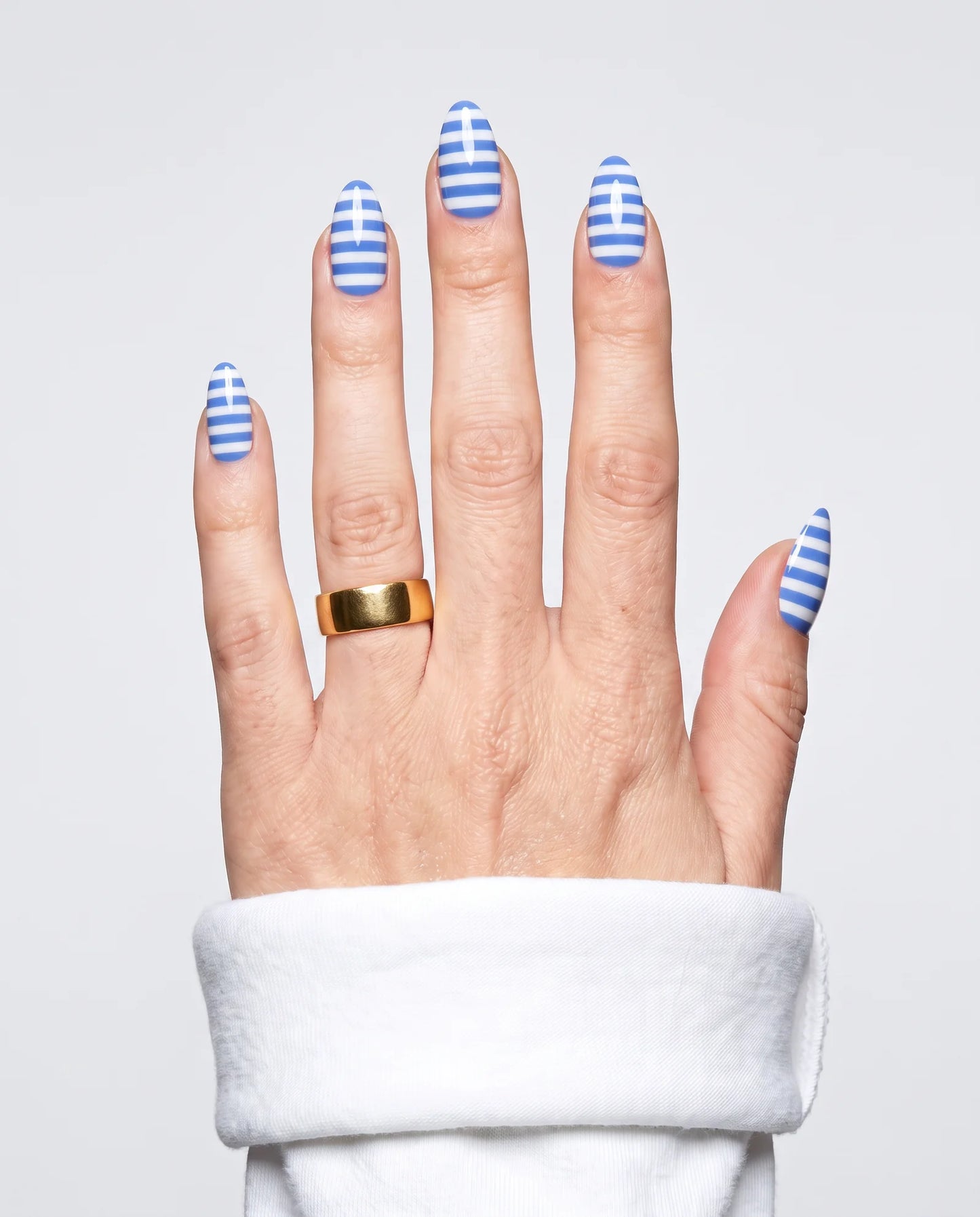 ShimmeryGlo UV free gel nail wraps in Amalfi Stripe, worn on hand