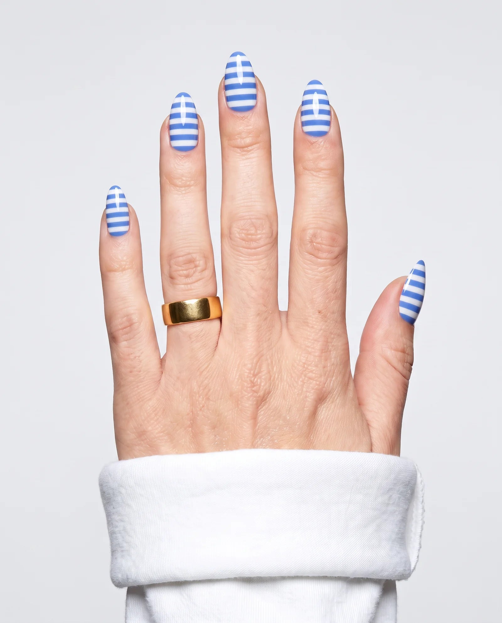 ShimmeryGlo UV free gel nail wraps in Amalfi Stripe, worn on hand