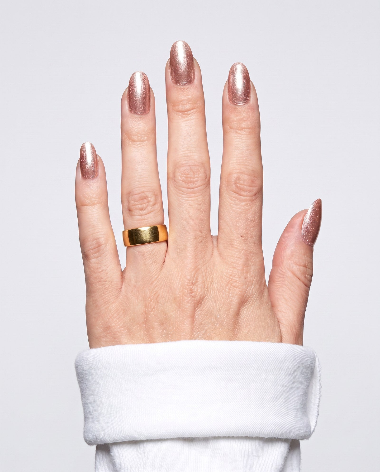 ShimmeryGlo UV free gel nail wraps in Gilded Rose, worn on hand
