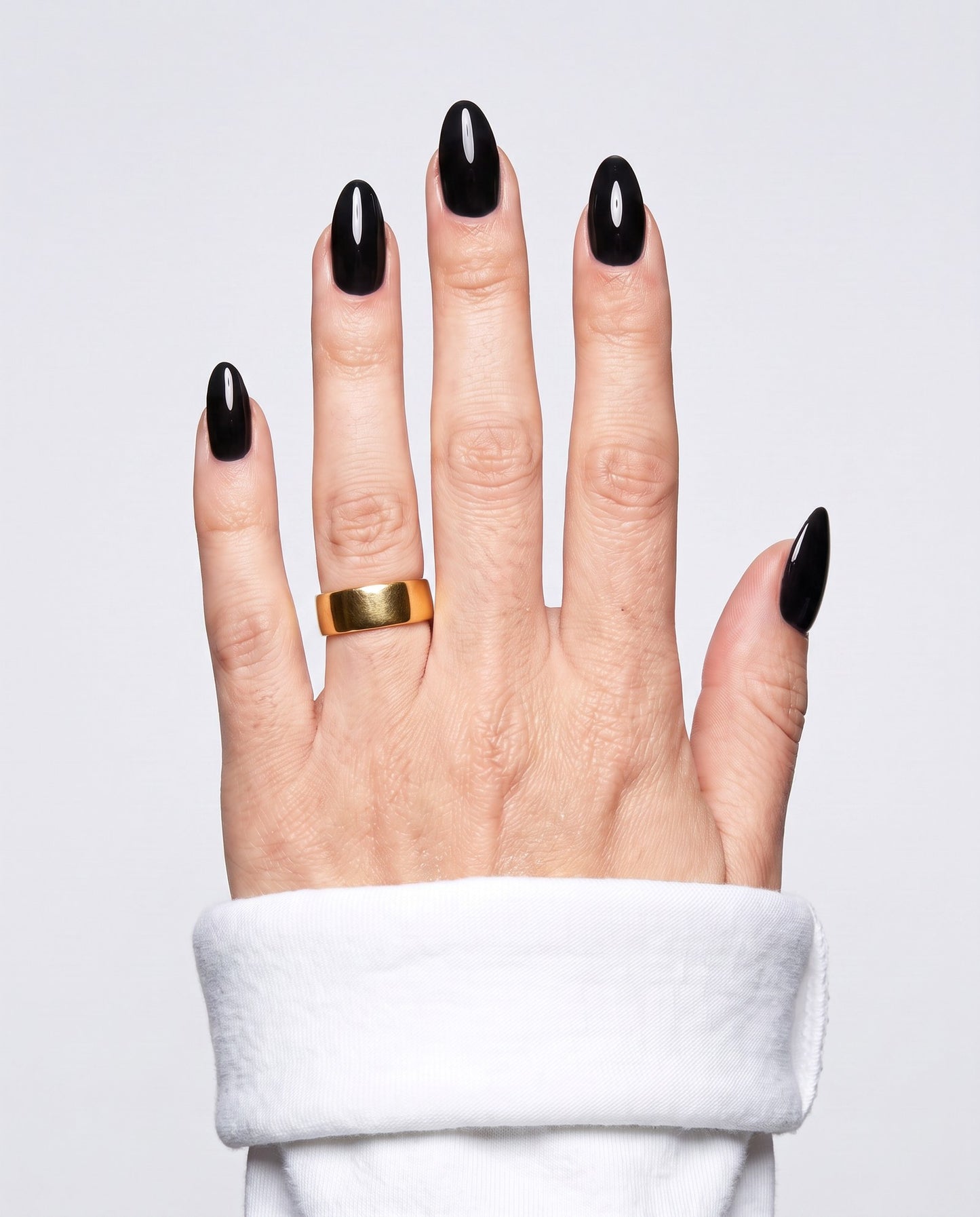 ShimmeryGlo UV free gel nail wraps in Liquid Noir, worn on hand
